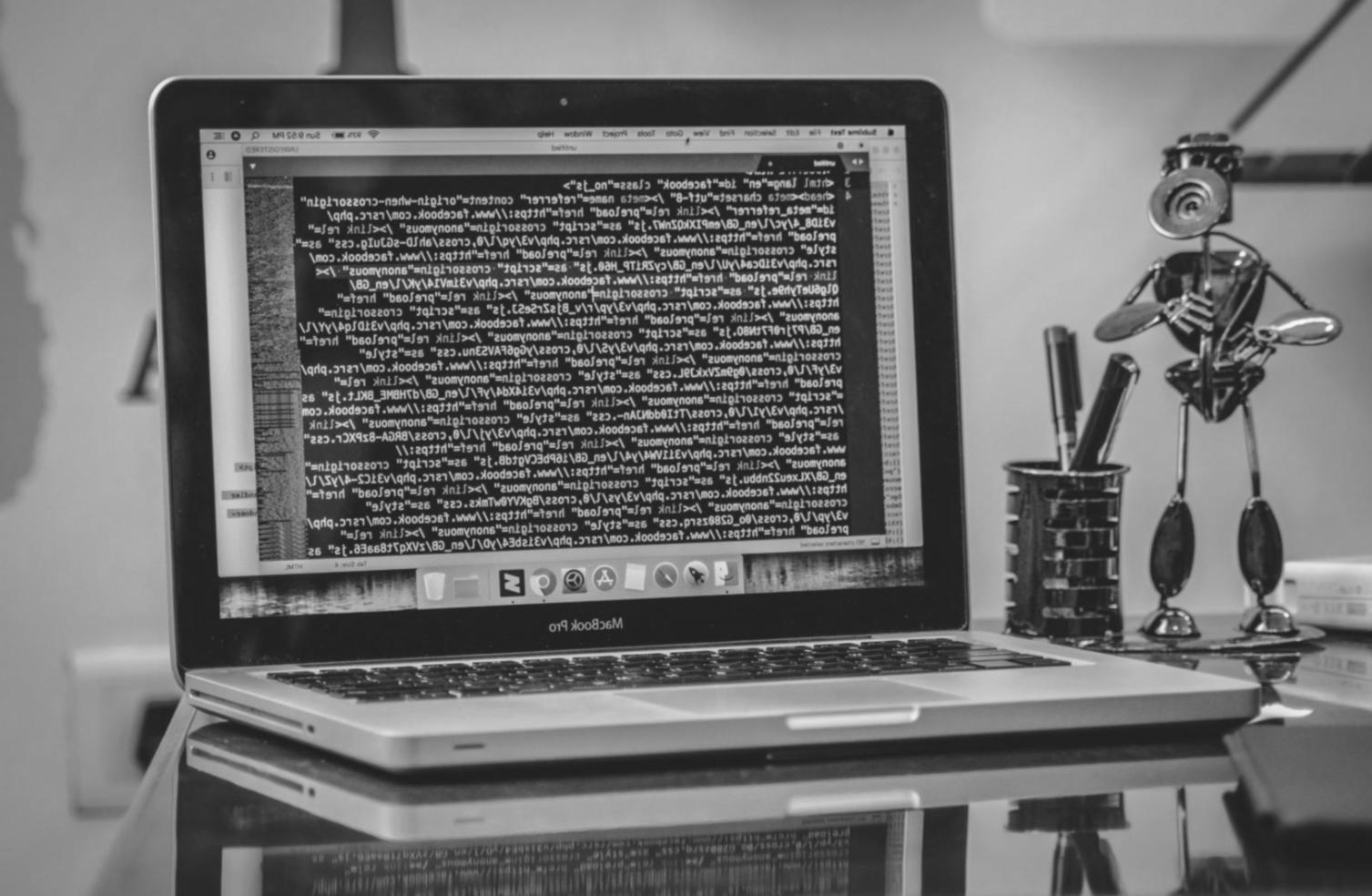 Professional web development workspace showing modern design tools and planning materials